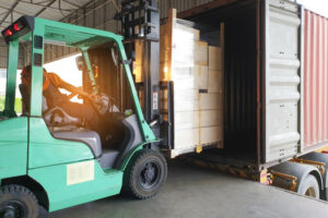 Forklift Driver Loading Cargo Into Container - 1